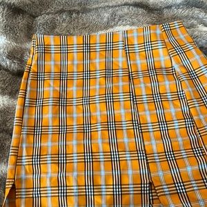 Woman orange plaid skirt